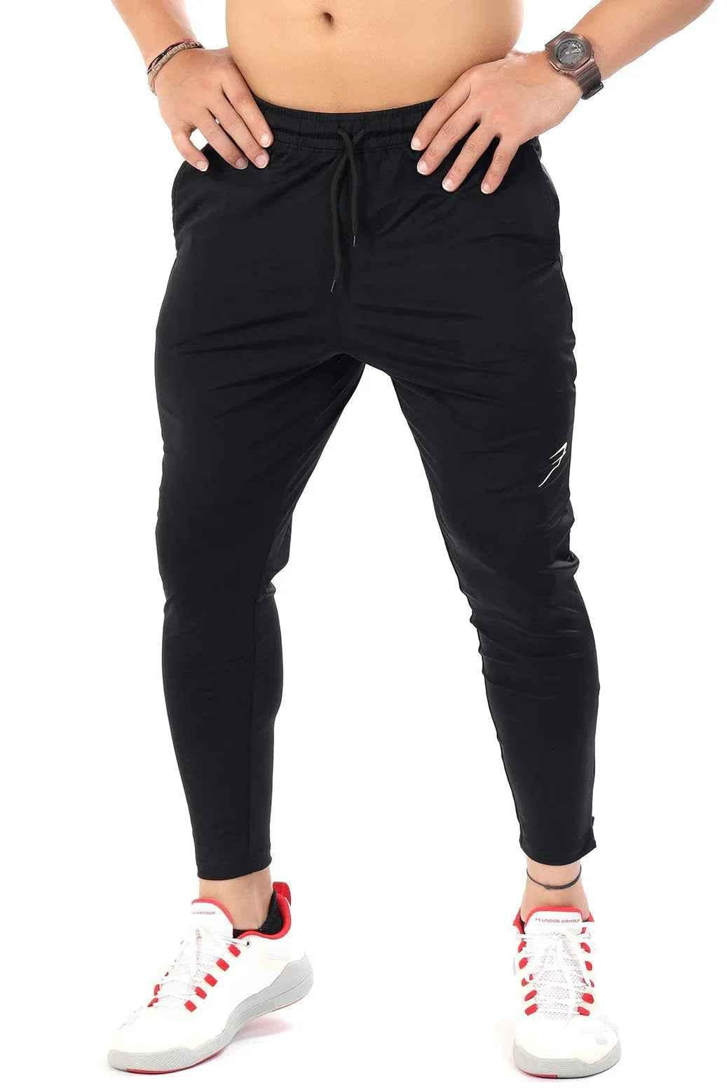 Black Nylon Supreme Tracks by Fuaark Nz, stylish athletic track pants with a sleek design and comfortable fit.
