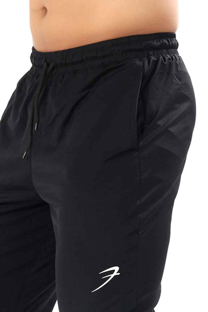 Black Nylon Supreme Tracks by Fuaark Nz, showing the sleek, comfortable track pants with a focus on fabric and design details.