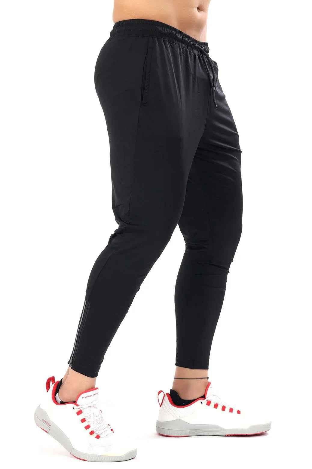 Black Nylon Supreme Tracks by Fuaark Nz, lightweight athletic track pants with a sleek design and comfortable fit.