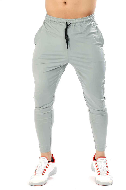 Light grey Nylon Supreme Track by Fuaark Nz, featuring smooth nylon fabric and sleek design for athletic or casual wear.