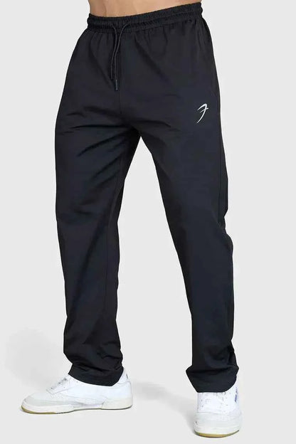 Fuaark NZ black casual track pants for men, featuring a relaxed fit and comfortable elastic waistband, suitable for everyday wear.