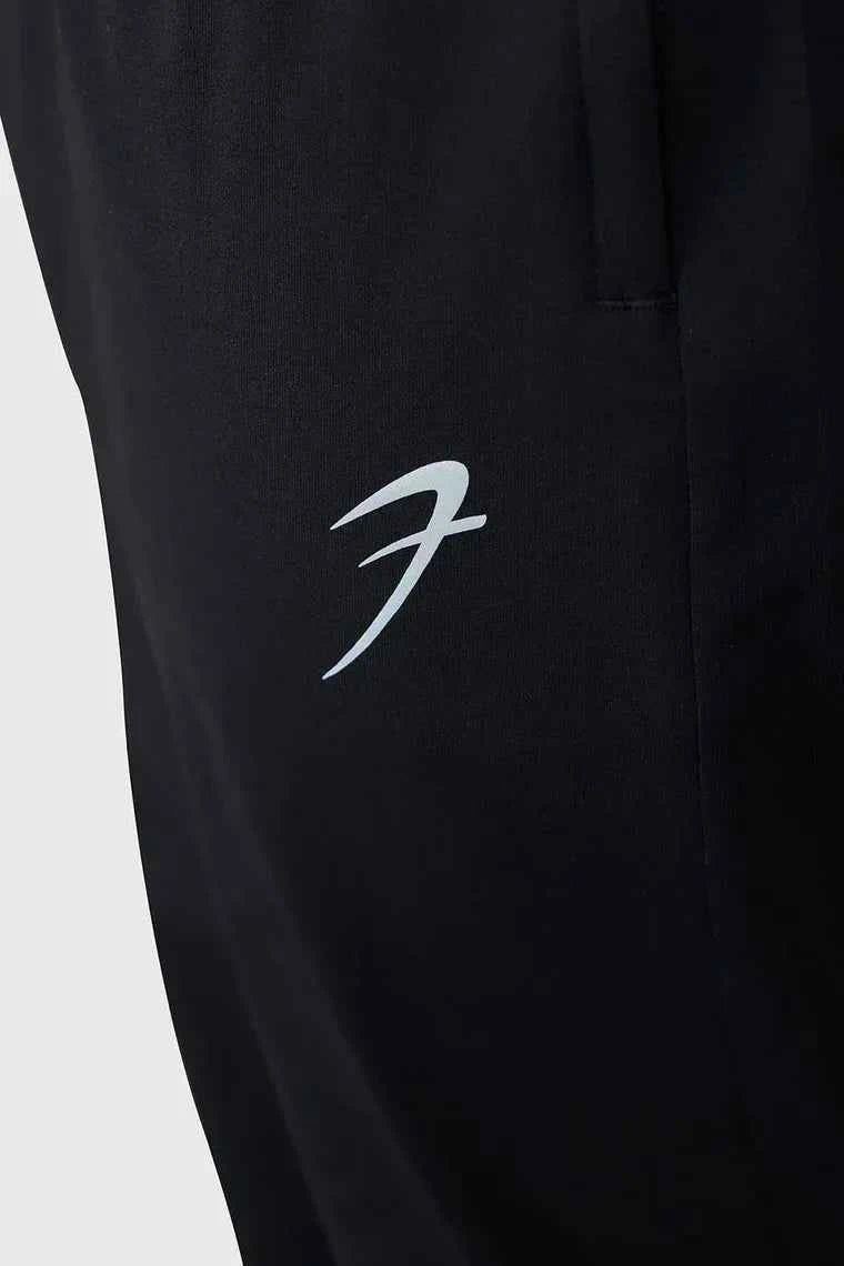 Fuaark Nz smart casual black track pants with a relaxed fit, featuring an elastic waistband and side pockets for comfort and style.