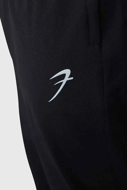 Fuaark Nz smart casual black track pants with a relaxed fit, featuring an elastic waistband and side pockets for comfort and style.