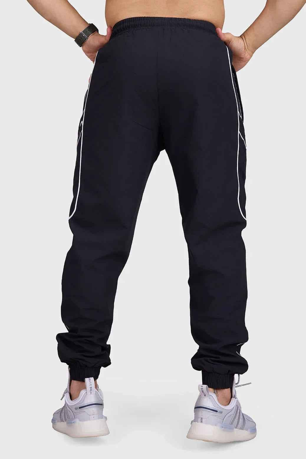 Black Fuaark Nz men's sprint joggers, lightweight activewear with a relaxed fit, designed for comfort and performance during workouts.