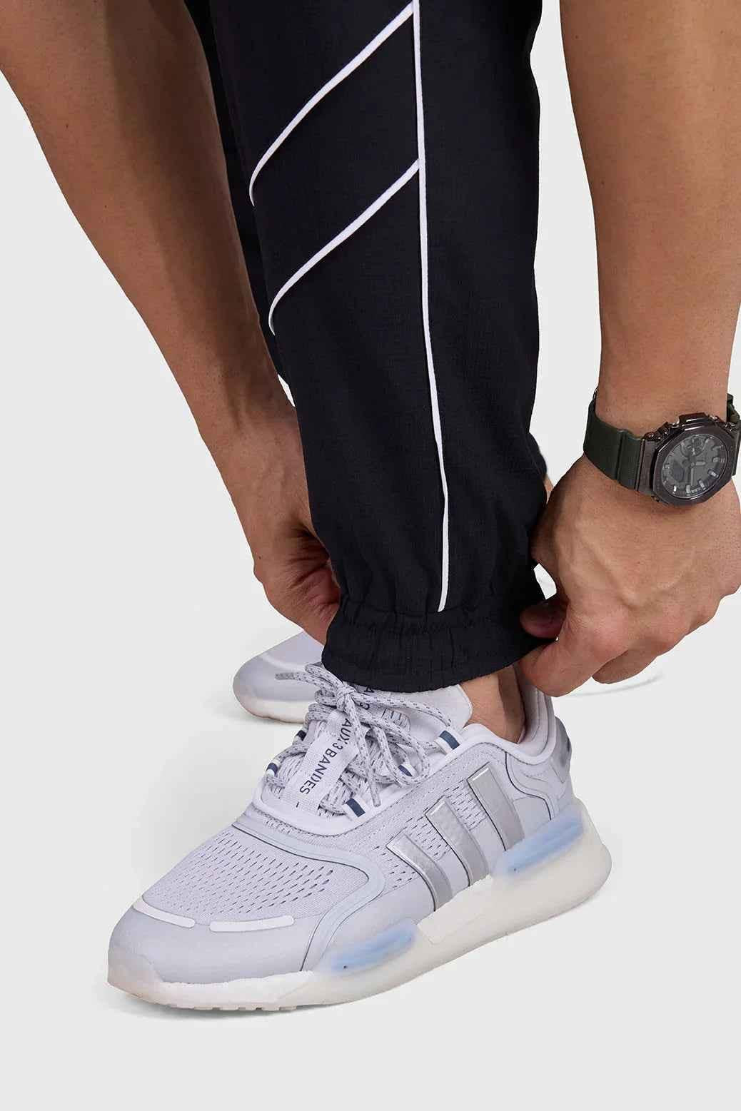 Black men's Sprint Joggers by Fuaark NZ, featuring athletic track design for comfort and performance.