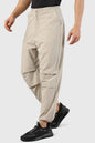 Beige Sublime Parachute Pants by Fuaark Nz, stylish track pants with a relaxed fit and modern design.