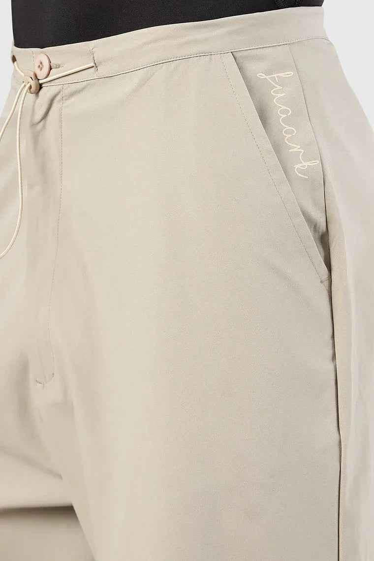 Beige Sublime Parachute Pants by Fuaark Nz, relaxed fit track pants with parachute-style design and adjustable waistband.