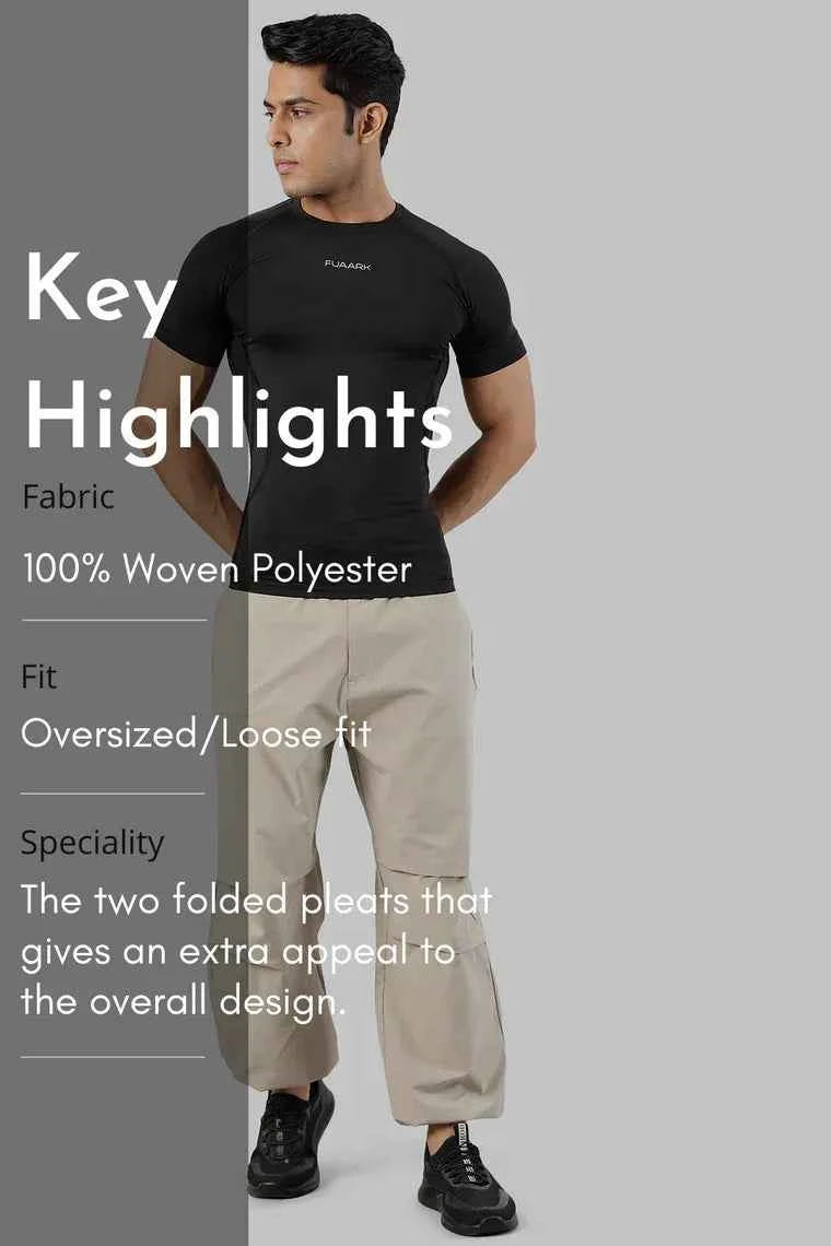 Beige Fuaark Nz Sublime Parachute Pants track pants with relaxed fit and adjustable waistband, casual and comfortable style.