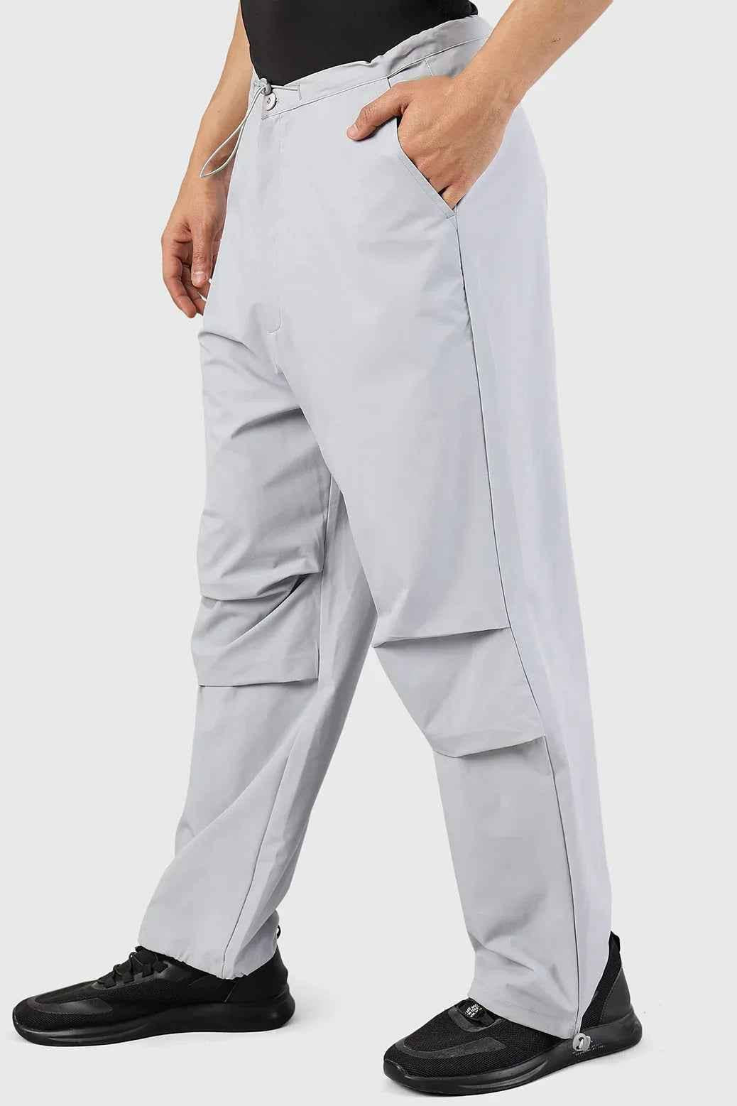 Light grey Fuaark Nz Sublime parachute pants, stylish track pants with relaxed fit and modern design.