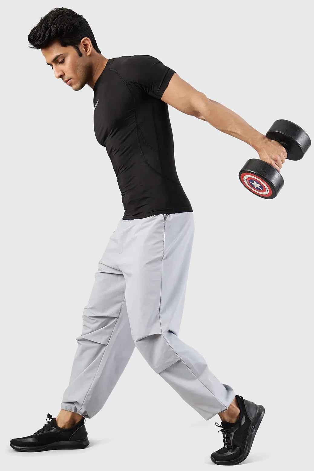 Light grey Sublime Parachute Pants by Fuaark Nz, stylish track pants with a relaxed fit and modern design.