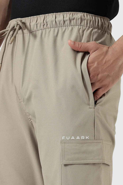 Beige Fuaark Nz Vitality Straight Track Pants displayed flat, showing the slim fit design and smooth fabric.
