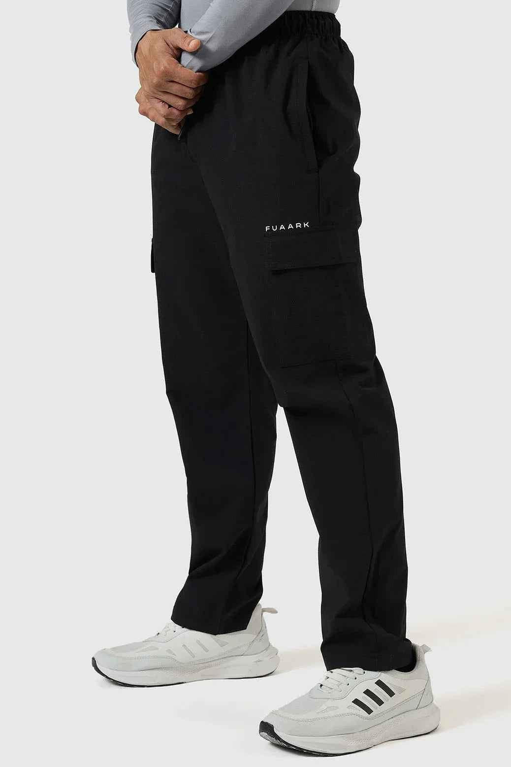 Black Fuaark Nz Vitality Straight Track Pants laid flat, showing the sleek design and comfortable fit for active wear.