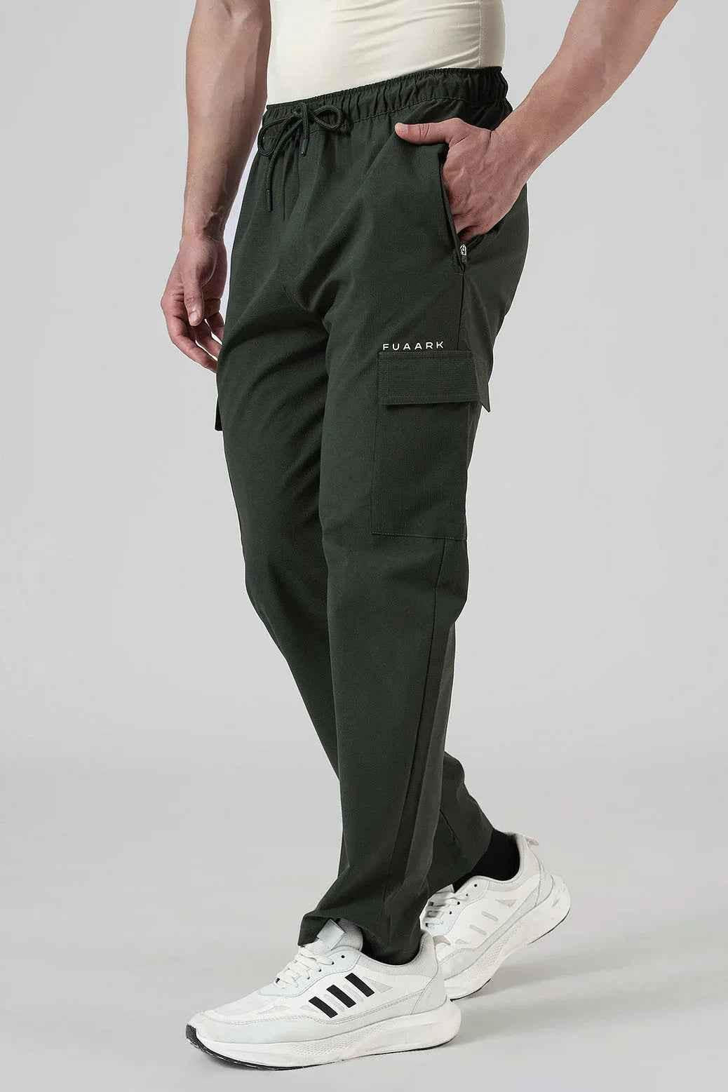 Olive green Fuaark NZ Vitality Straight Pants track pants with a relaxed fit, shown on a model.