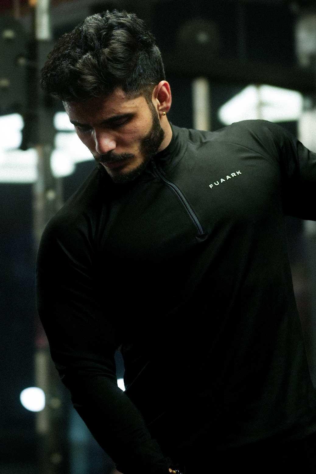 Black Axis Pullover T-shirt by Fuaark Nz, showing a casual fit with a round neckline and minimal branding.