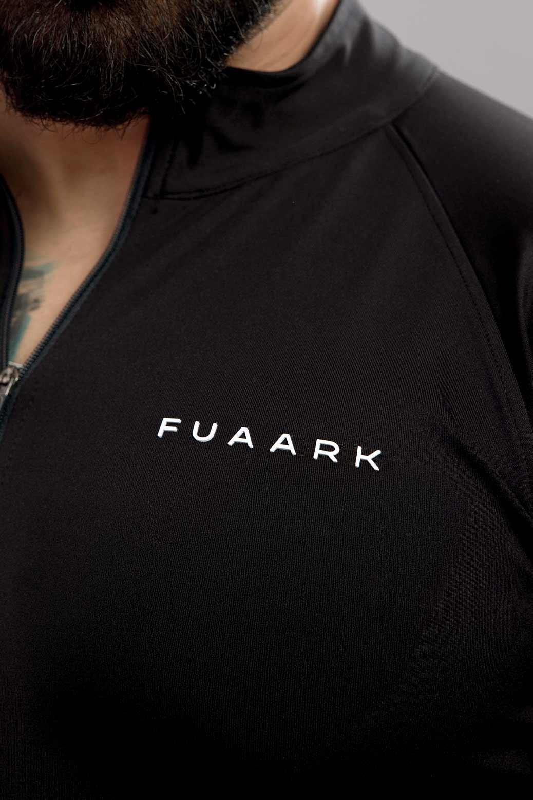 Black Fuaark NZ Axis Pullover T-shirt displayed on a hanger with a relaxed fit and minimalist design.