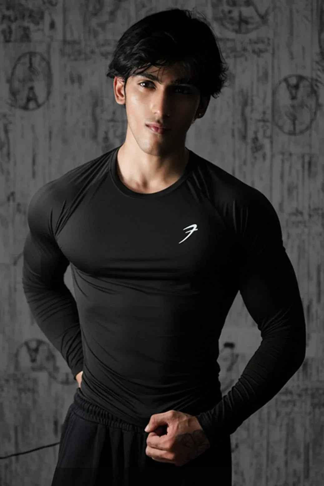 Black Bare Nylon Fullsleeves T-shirt by Fuaark Nz, showcasing a sleek, fitted design with full sleeves and minimal branding.