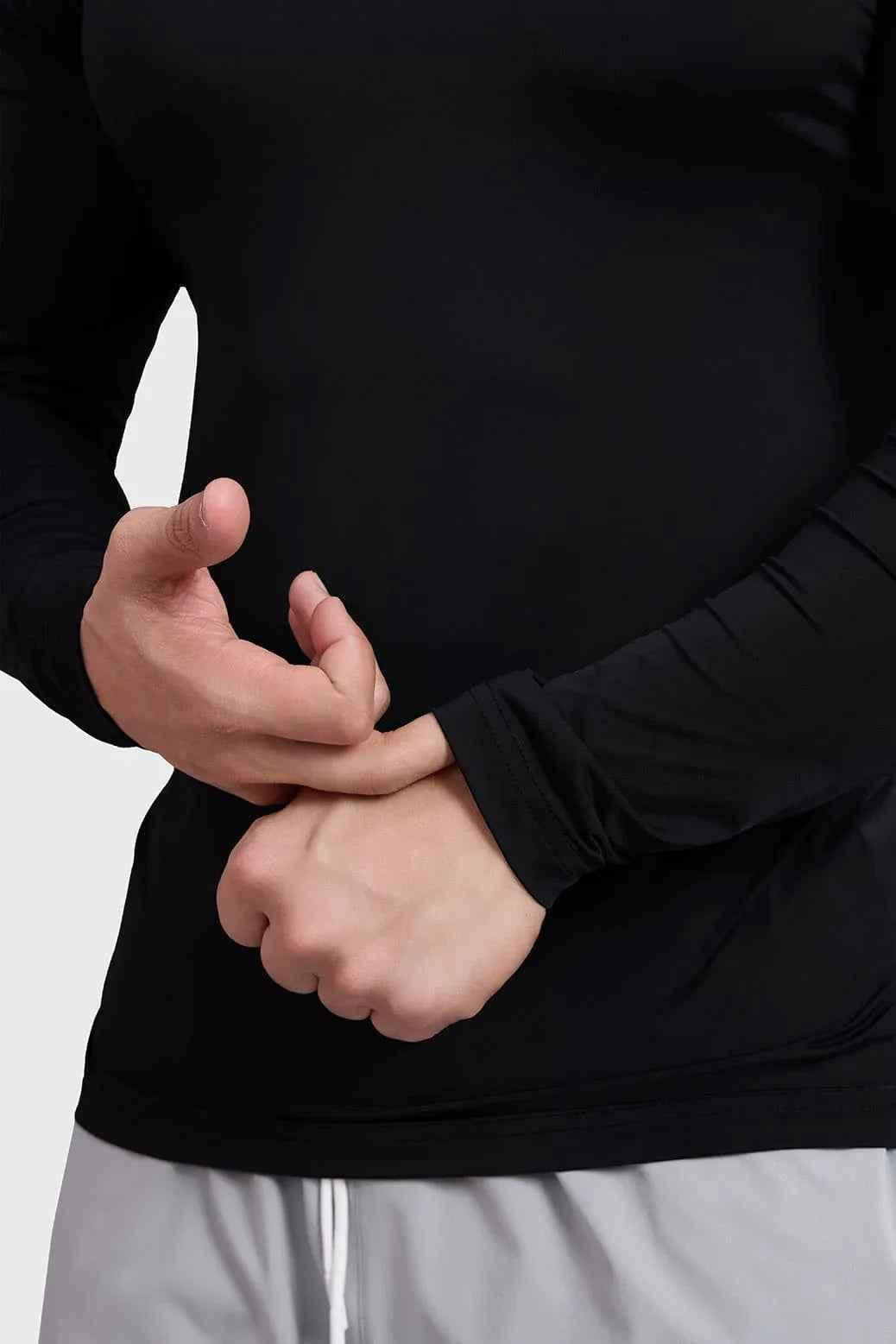 Black Bare Nylon Fullsleeves T-shirt by Fuaark Nz, close-up of the sleek, fitted long-sleeve shirt on a plain background.