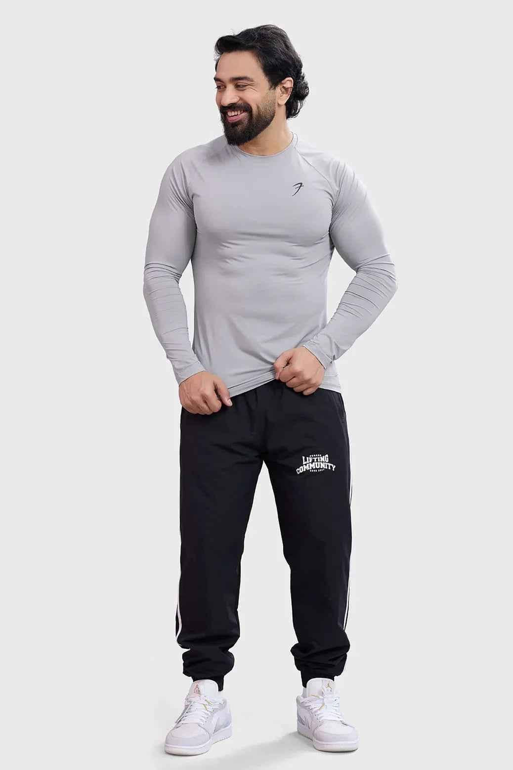 Light grey Bare Nylon full-sleeves T-shirt by Fuaark Nz, showing a close-up of the soft, fitted fabric and long sleeves.