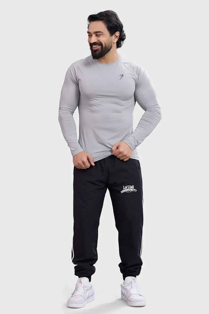 Light grey Bare Nylon full-sleeves T-shirt by Fuaark Nz, showing a close-up of the soft, fitted fabric and long sleeves.