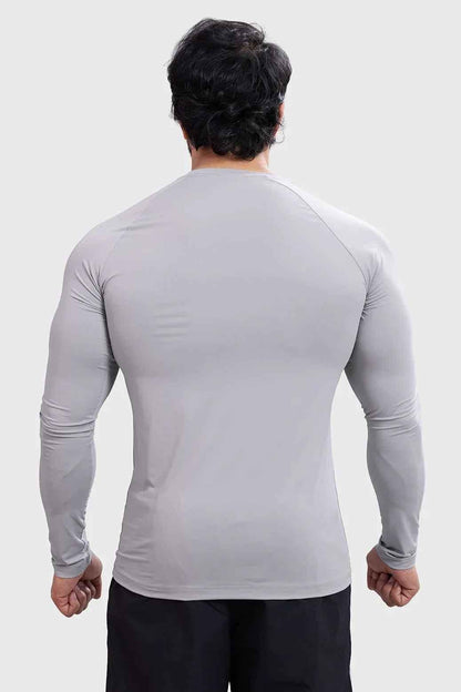 Light grey Bare Nylon full-sleeve T-shirt by Fuaark NZ, shown laid flat with soft fabric texture and fitted sleeves.