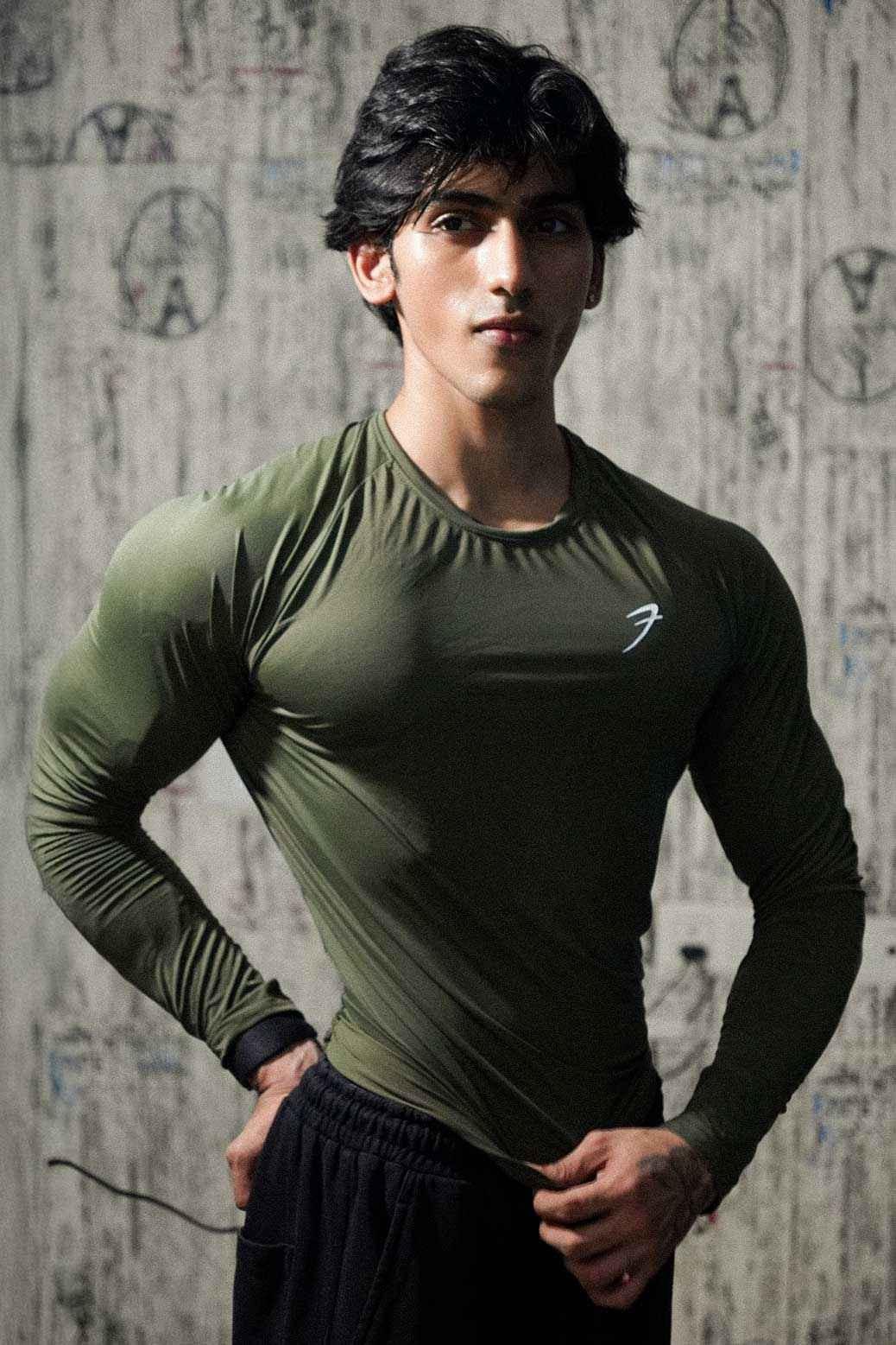Olive Bare Nylon full-sleeve T-shirt by Fuaark Nz, showcasing a fitted casual design with long sleeves and soft fabric.