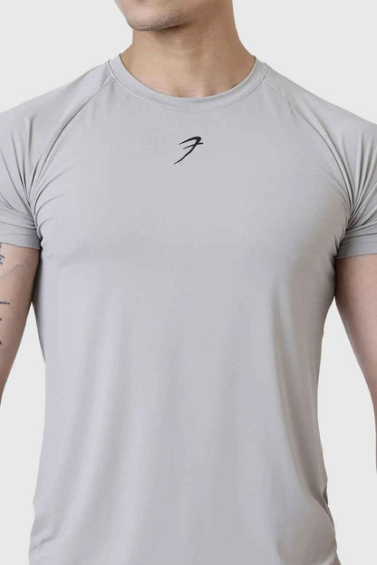 Light grey Bare Nylon T-shirt by Fuaark Nz, showcasing a casual fit and smooth fabric on a clean background.