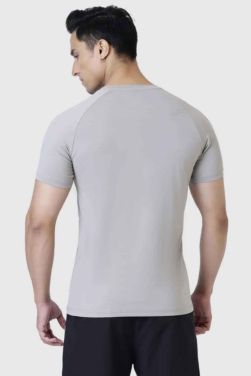 Light grey Fuaark Nz Bare Nylon T-shirt displayed flat, showcasing its soft fabric and minimalist design.