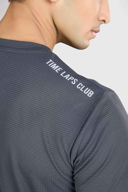 Grey Fuaark NZ running T-shirt with checks, lightweight and breathable performance tee for active wear.