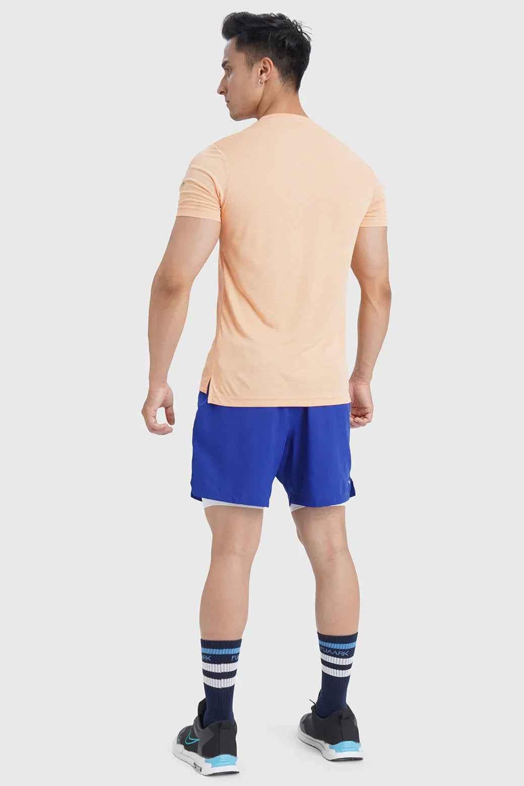 Peach checks running T-shirt from Fuaark Nz with a comfortable fit, casual style, and breathable fabric for active wear.
