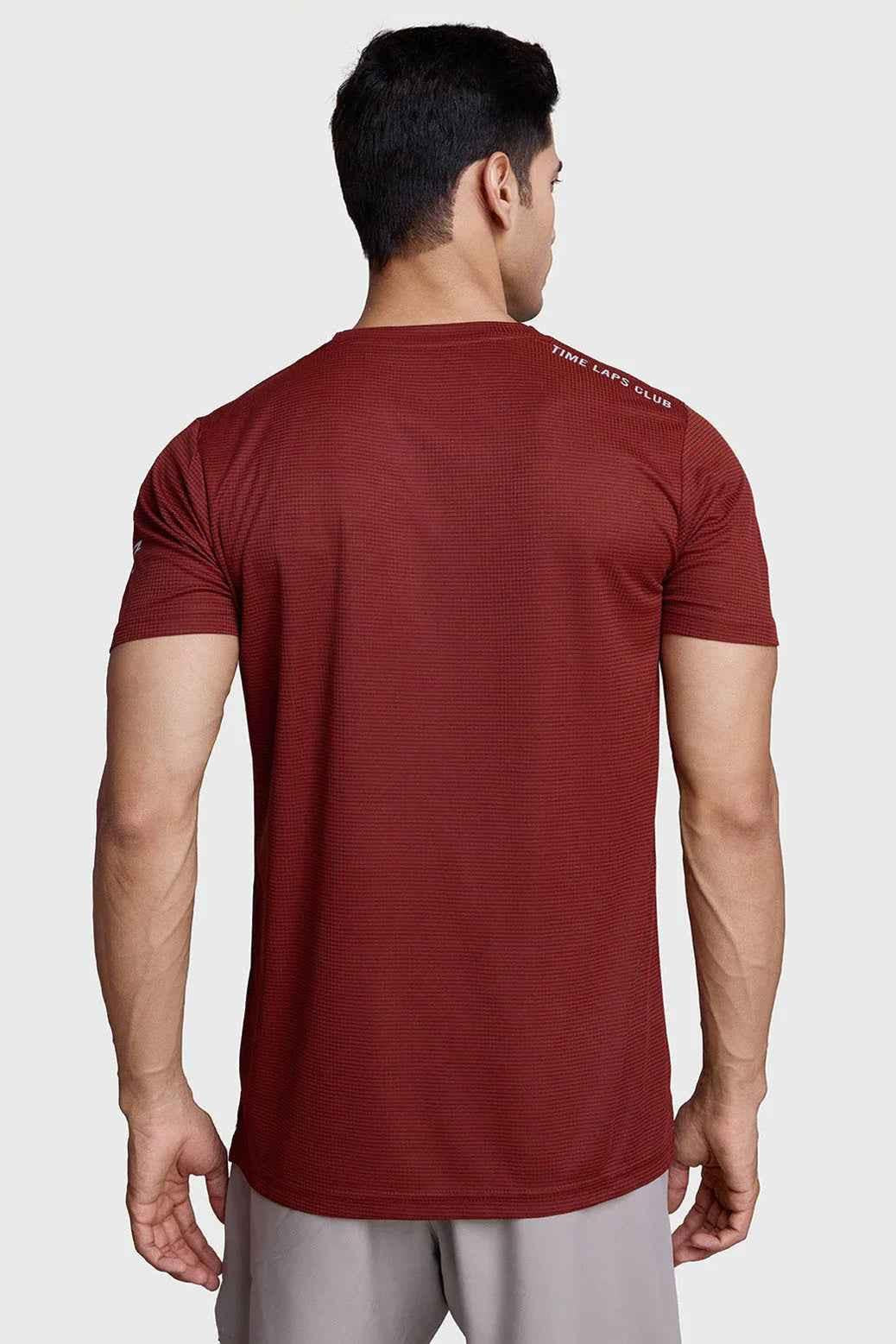 Fuaark Nz Checks Running T-shirt in Salsa color, lightweight athletic T-shirt with checkered pattern for running and casual wear.