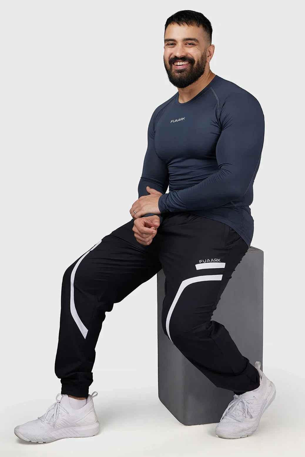 Grey Compression 2.0 Full Sleeves T-shirt by Fuaark Nz, made of breathable fabric with a snug fit for athletic wear.