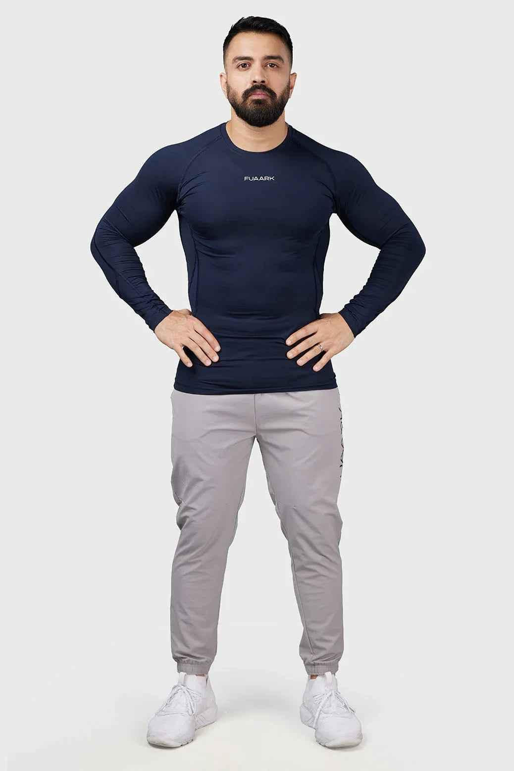 Navy Fuaark Nz Compression 2.0 full sleeves T-shirt displayed on a hanger, showcasing its fitted design and fabric texture.