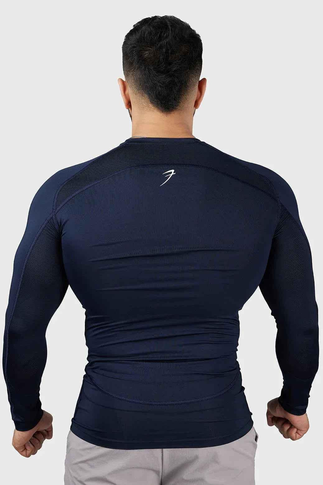 Navy Fuaark Nz Compression 2.0 full sleeves T-shirt, sporty and fitted for active wear, made of breathable fabric.