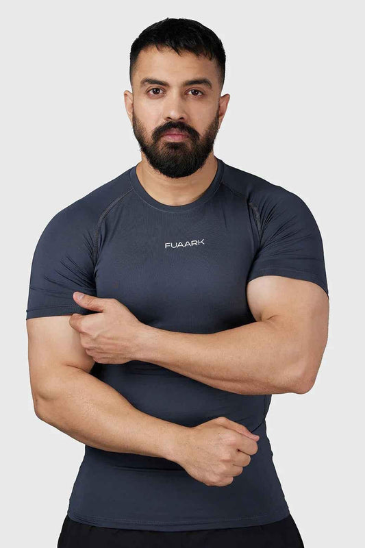 Grey Compression 2.0 T-shirt by Fuaark Nz, close-up of fitted sports T-shirt with logo and textured fabric details.