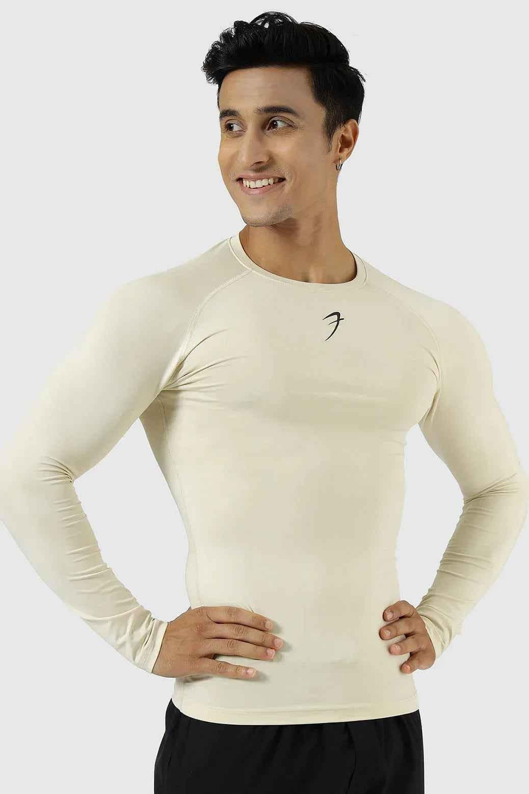 Beige compression fullsleeves T-shirt by Fuaark Nz, close-up of fitted fabric and sleek design on a mannequin.