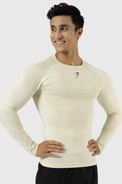 Beige compression fullsleeves T-shirt by Fuaark Nz, close-up of fitted fabric and sleek design on a mannequin.