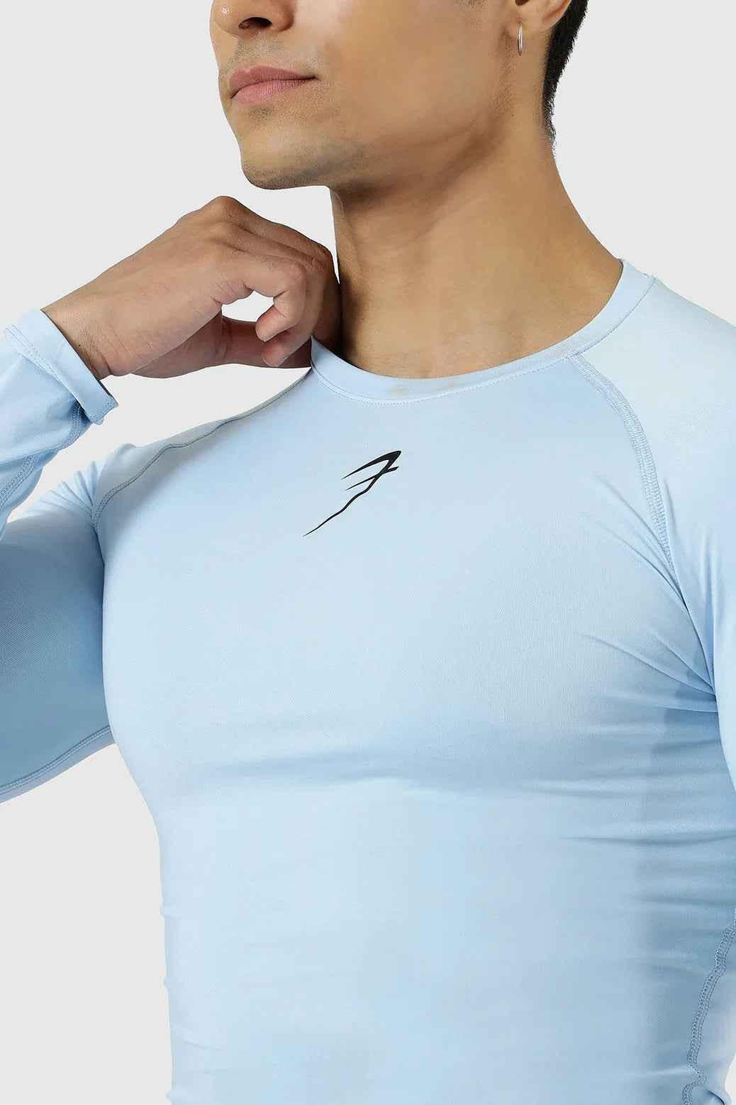 Fuaark Nz compression full-sleeves T-shirt in Glacial Blue, close-up of the fitted athletic shirt with smooth fabric.