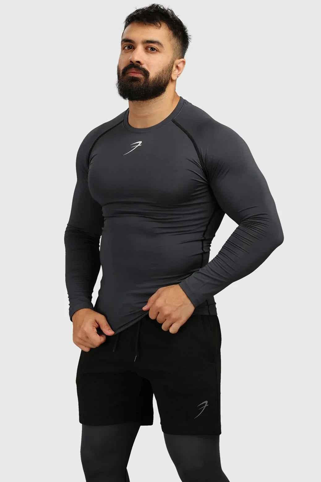 Grey Fuaark Nz compression full-sleeves T-shirt with a snug fit, ideal for athletic wear and active lifestyles.
