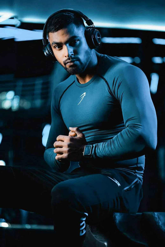 Grey Fuaark Nz compression full-sleeves T-shirt, shown flat on a white background, highlighting its fit and fabric texture.
