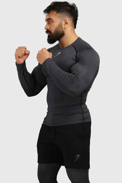 Grey compression full-sleeves T-shirt by Fuaark Nz, featuring a snug fit and athletic style for active wear.