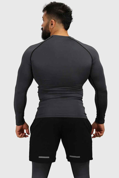 Grey compression fullsleeves T-shirt by Fuaark Nz, shown on a model highlighting the snug fit and athletic design.