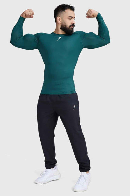 Fuaark Nz compression fullsleeves T-shirt in emerald green, designed for comfort and performance, shown on a model.