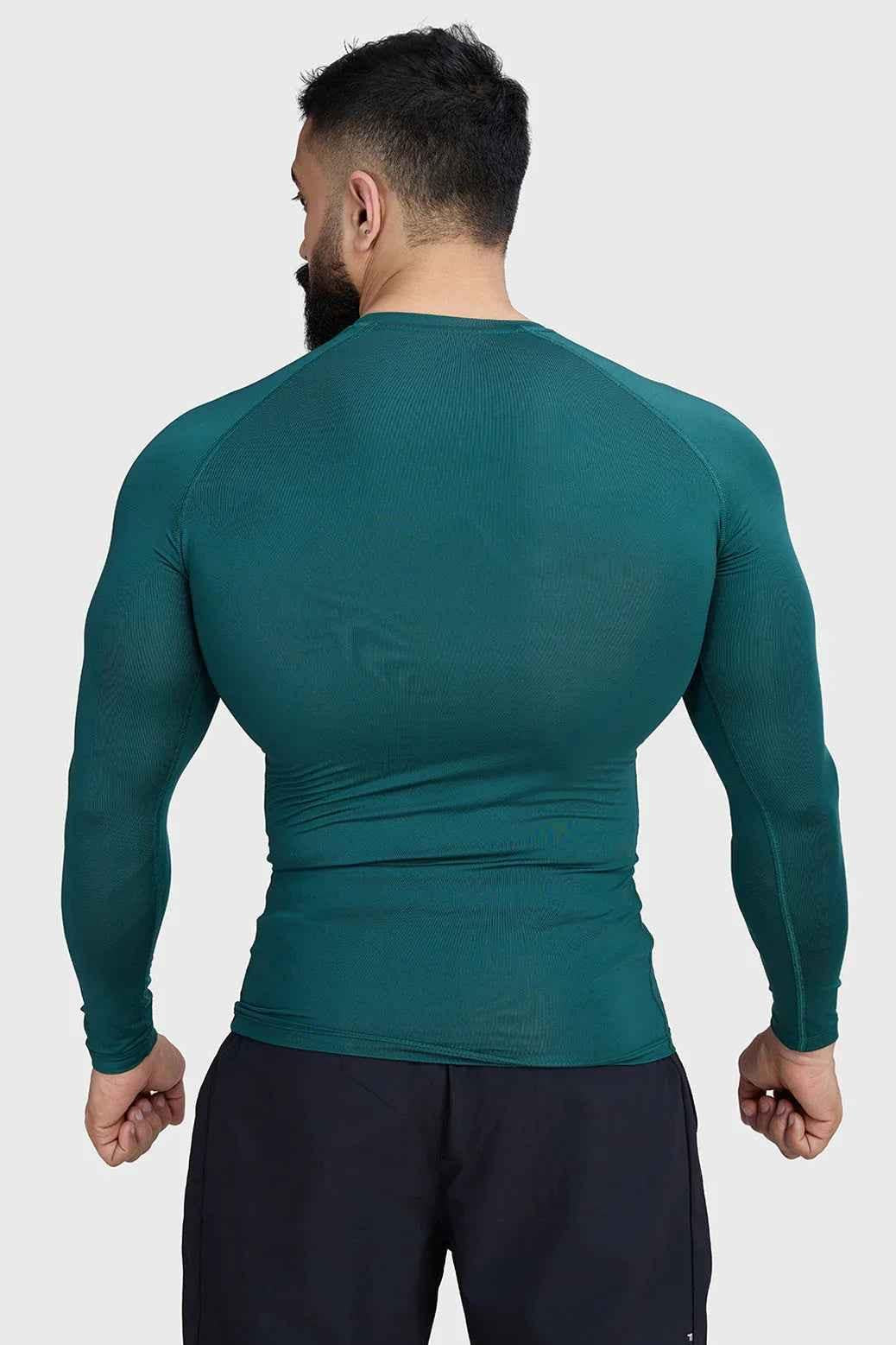 Fuaark Nz compression full-sleeve T-shirt in emerald green, designed for comfort and performance, shown on a mannequin.