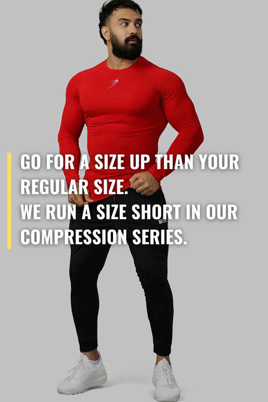 Red compression full-sleeve T-shirt by Fuaark Nz, close-up of fitted athletic shirt with long sleeves and subtle branding.