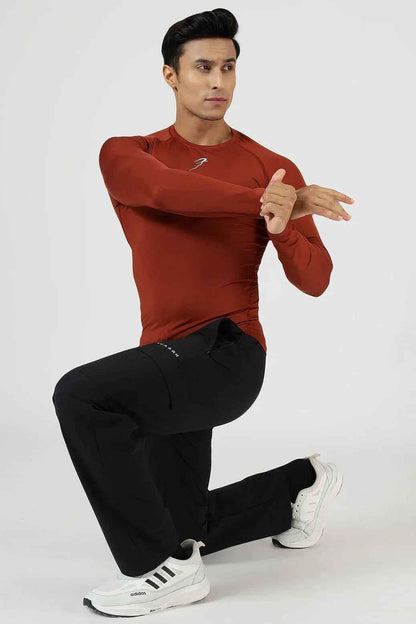 Fuaark Nz compression full-sleeves T-shirt in salsa color, designed for athletic wear with a snug fit and breathable fabric.