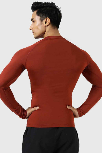 Fuaark Nz compression full-sleeves T-shirt in salsa color, designed for comfort and athletic performance.