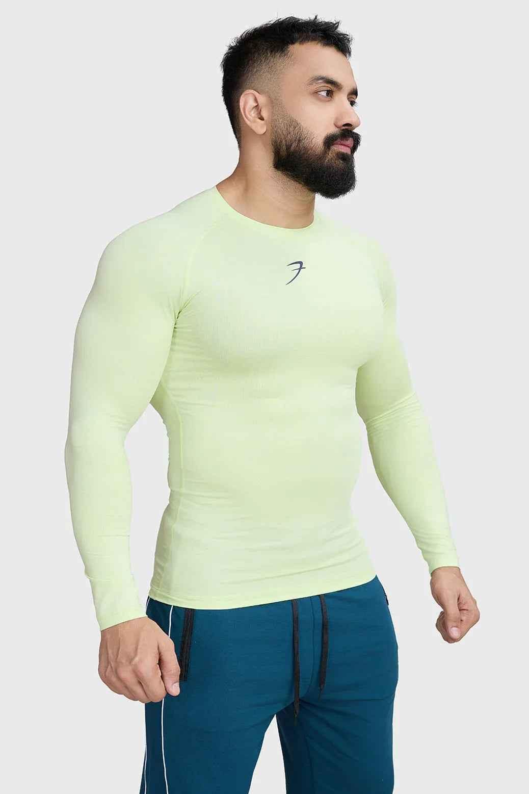 Fuaark Nz compression long sleeve lime T-shirt for enhanced performance, showcasing a fitted athletic shirt with moisture-wicking fabric.