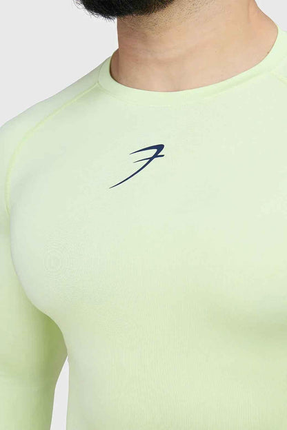 Fuaark Nz lime compression long sleeve T-shirt for enhanced athletic performance, shown on a model.