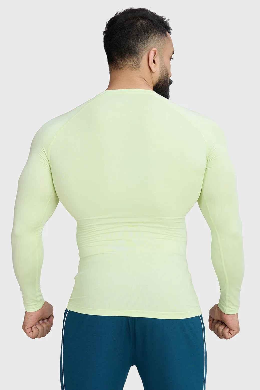 Fuaark Nz lime compression long sleeve T-shirt for men, designed for enhanced athletic performance and muscle support.