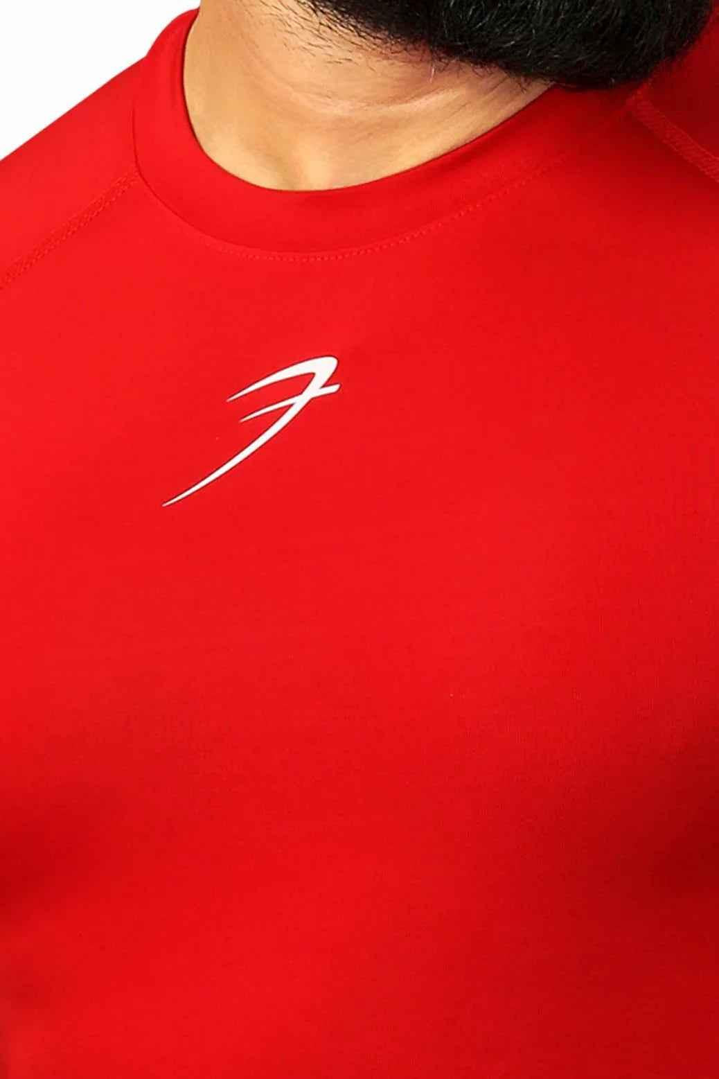 Red compression T-shirt by Fuaark Nz designed for enhanced performance and comfort, featuring a snug fit and breathable fabric.